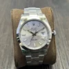 Rolex Oyster Perpetual Datejust 41 mm watch with a silver index dial, smooth stainless steel bezel, and Oyster bracelet